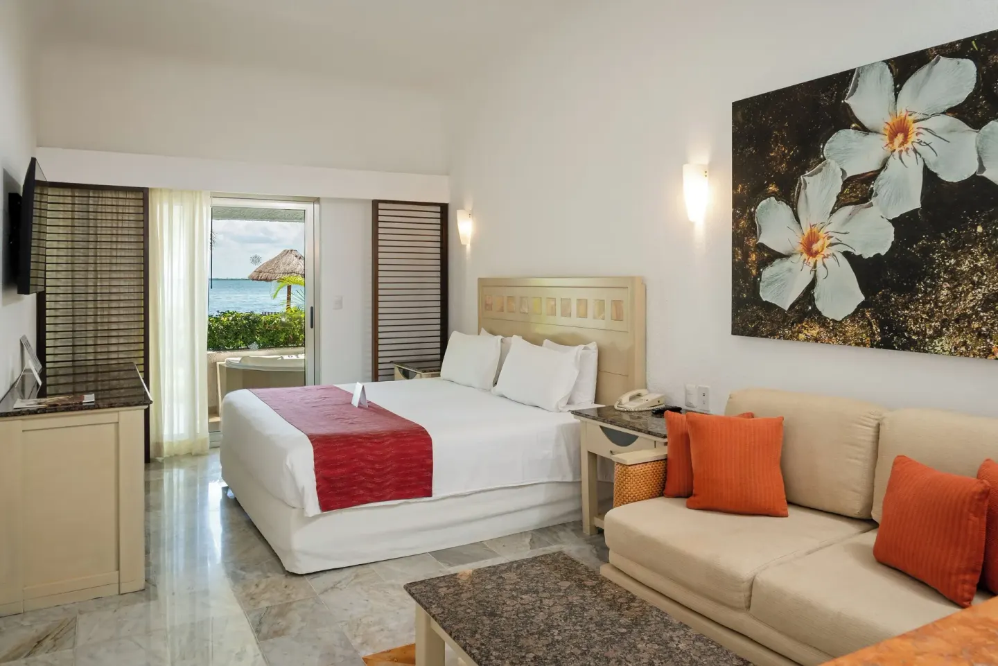 Standard Room Lagoon View with king bed and sofa at Sunset Marina Resort & Yacht Club.