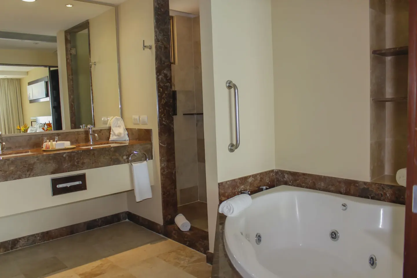 Bathroom with jetted tub, vanity and shower at Sunset Plaza Beach Resort & Spa Pto Vallarta.