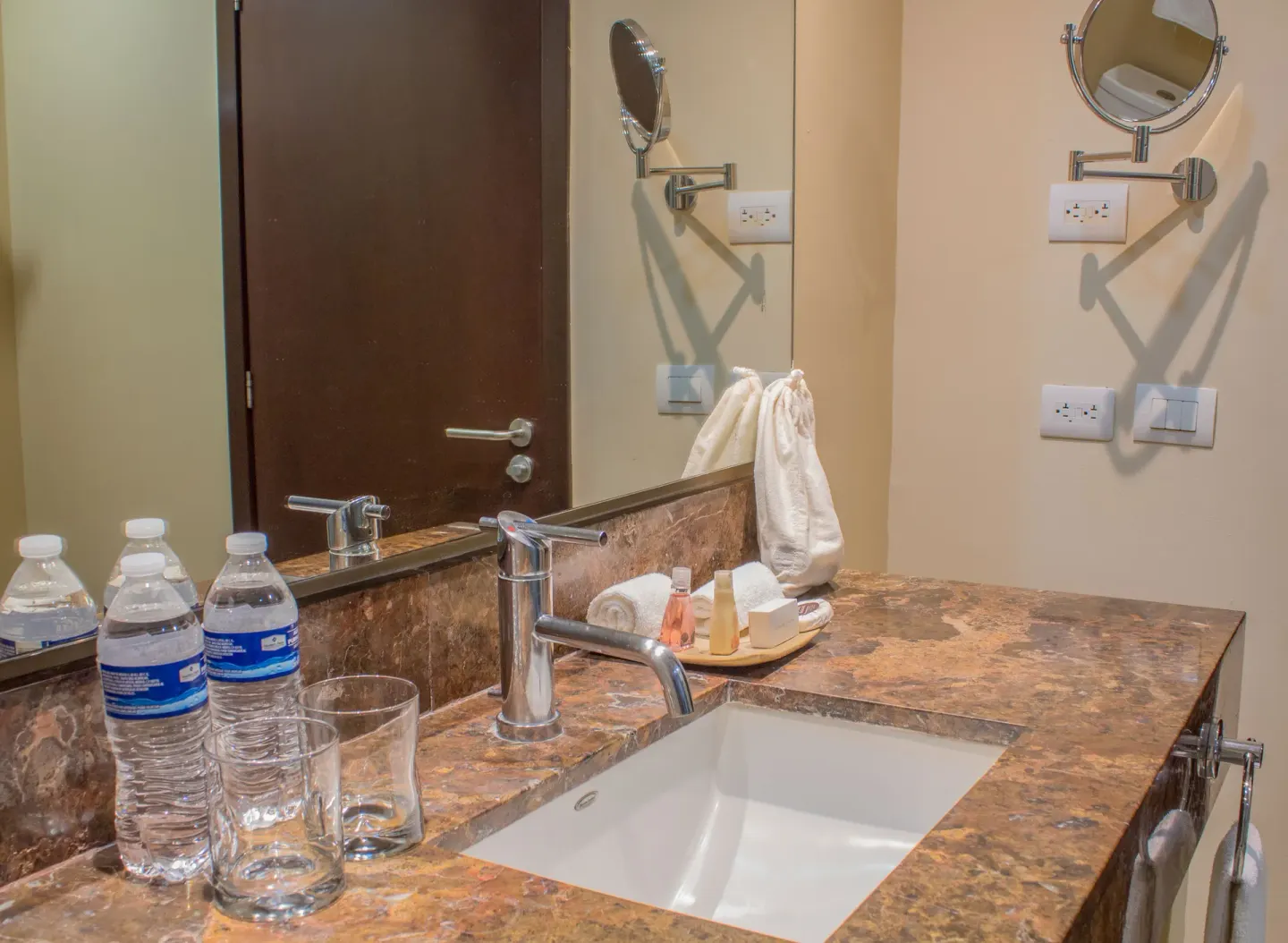 Bathroom vanity with sink and mirror at Sunset Plaza Beach Resort & Spa Pto Vallarta.