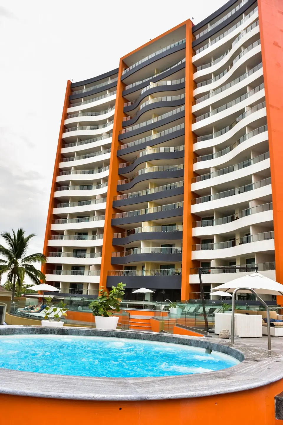 Resort tower and hot tub at Sunset Plaza Beach Resort & Spa Pto Vallarta.