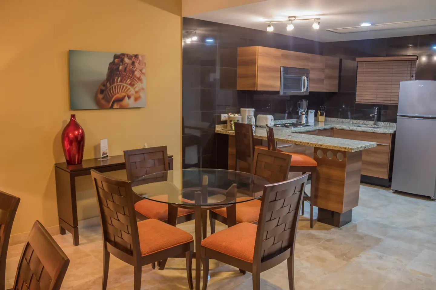 Suite dining area and kitchen at Sunset Plaza Beach Resort & Spa Pto Vallarta.
