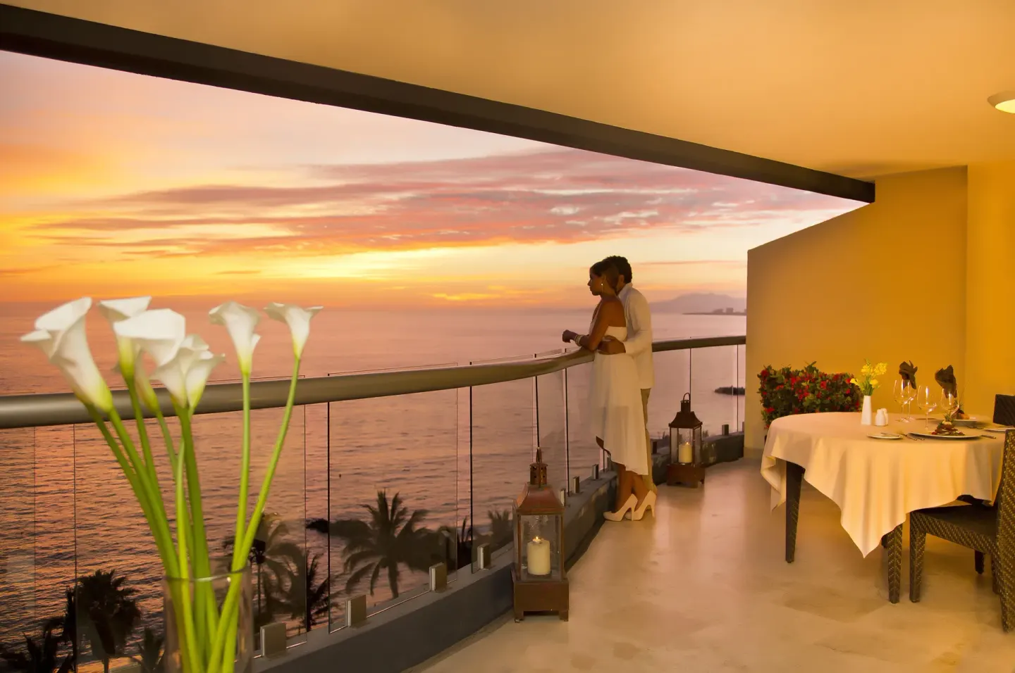 Deluxe Ocean Front balcony at sunset at Sunset Plaza Beach Resort & Spa Pto Vallarta.