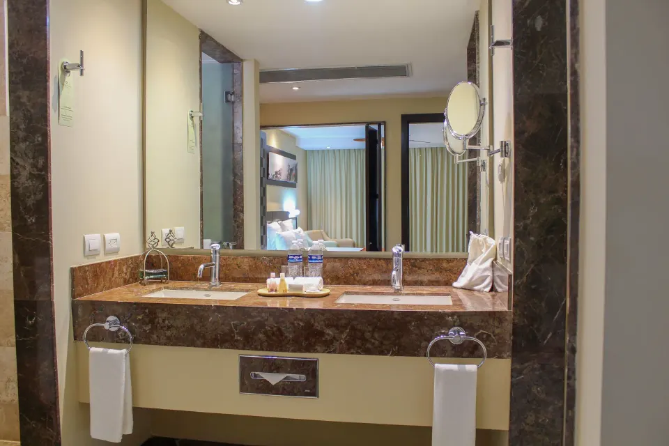 Deluxe Ocean Front bathroom with double vanity at Sunset Plaza Beach Resort & Spa Pto Vallarta.