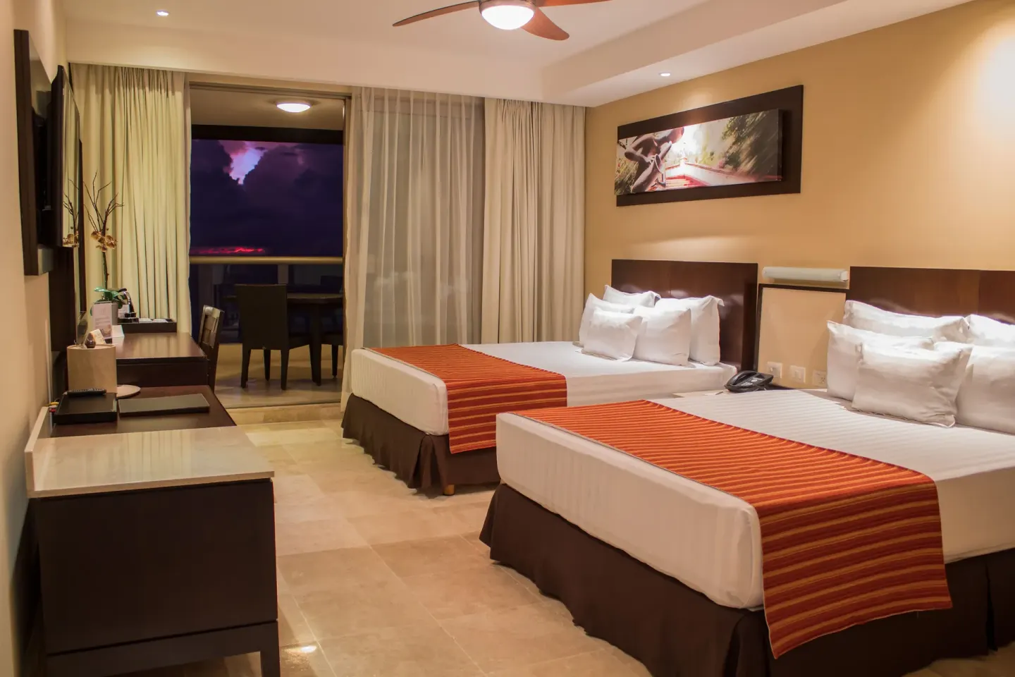 Deluxe Ocean Front room with two beds and balcony at Sunset Plaza Beach Resort & Spa Pto Vallarta.