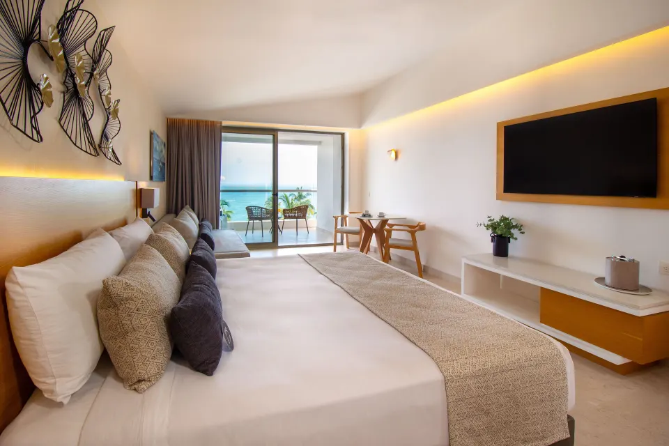 Deluxe Premium Ocean Front king room with balcony and ocean view at Sunset Plaza Beach Resort & Spa Pto Vallarta.