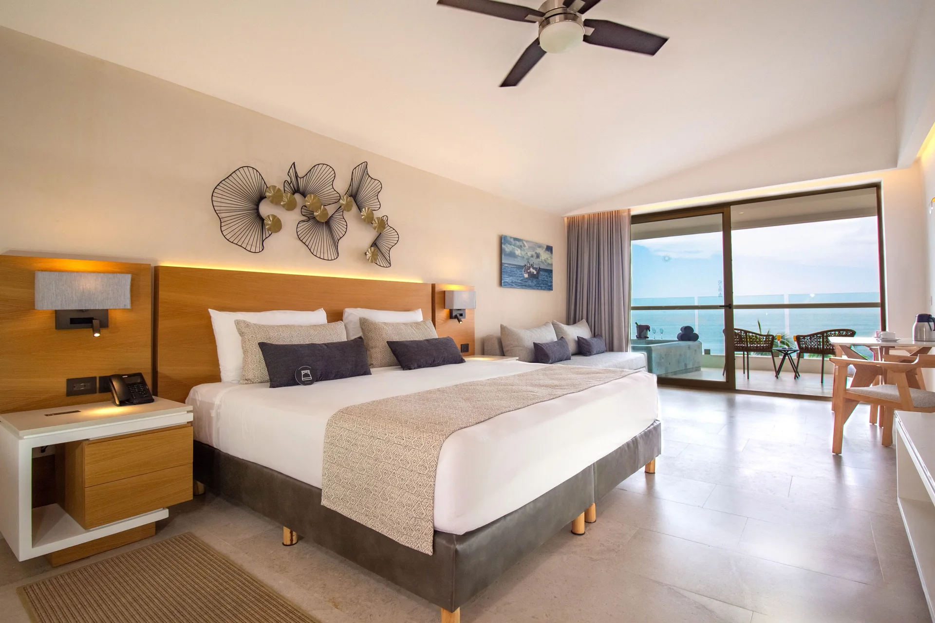 Superior Deluxe Suite at Sunset Plaza Beach Resort & Spa Puerto Vallarta with king bed, modern décor, and oceanfront ambiance.