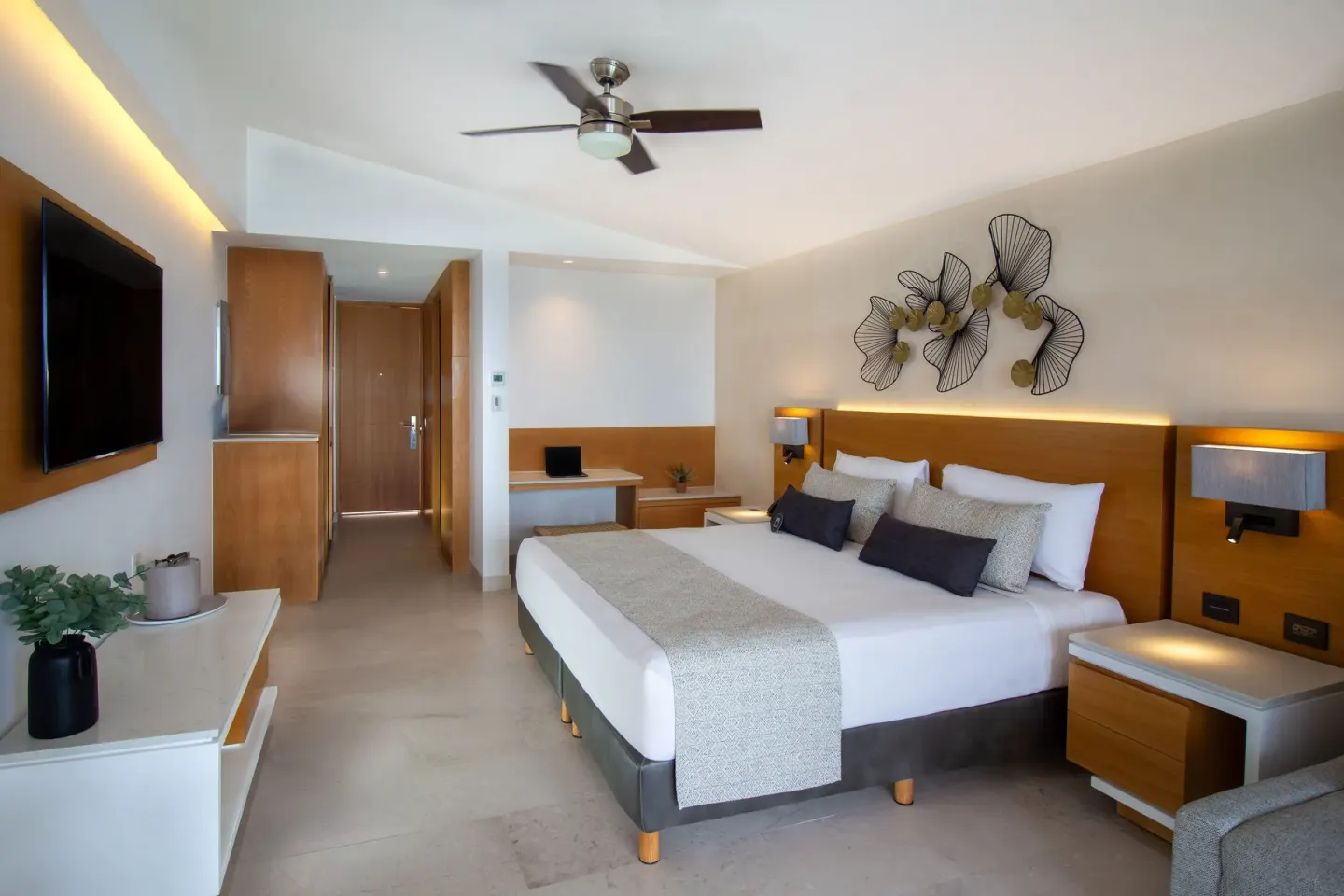 Deluxe Premium Ocean Front king room with TV and desk at Sunset Plaza Beach Resort & Spa Pto Vallarta.