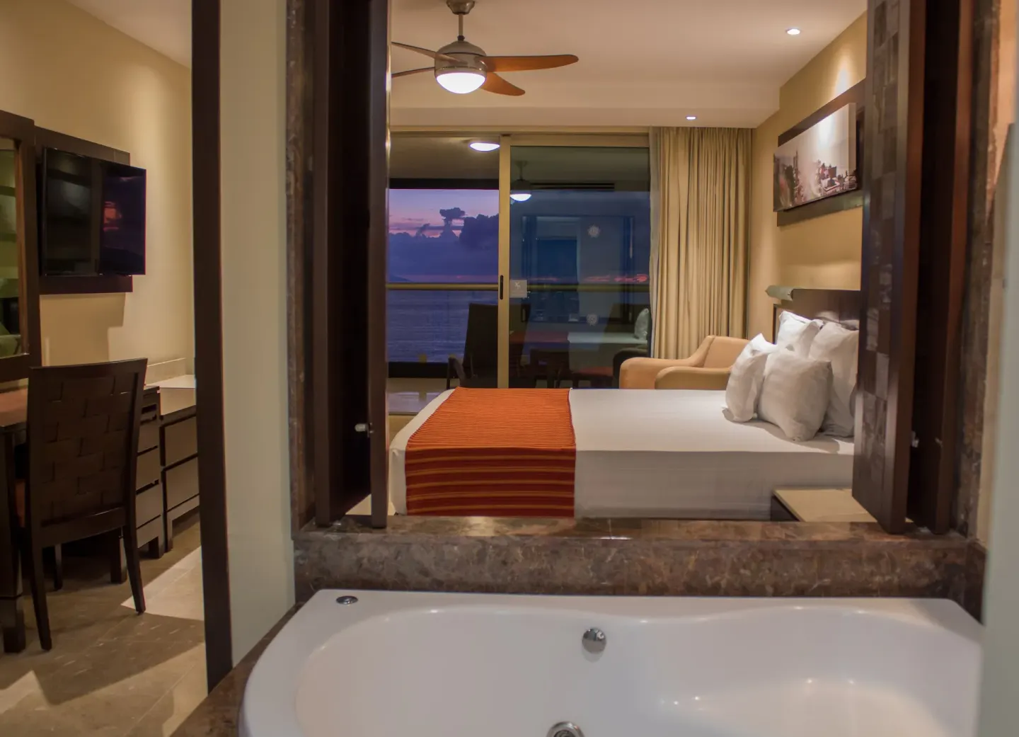 Oceanfront Suite hot tub facing king bedroom at Sunset Plaza Beach Resort & Spa Pto Vallarta.
