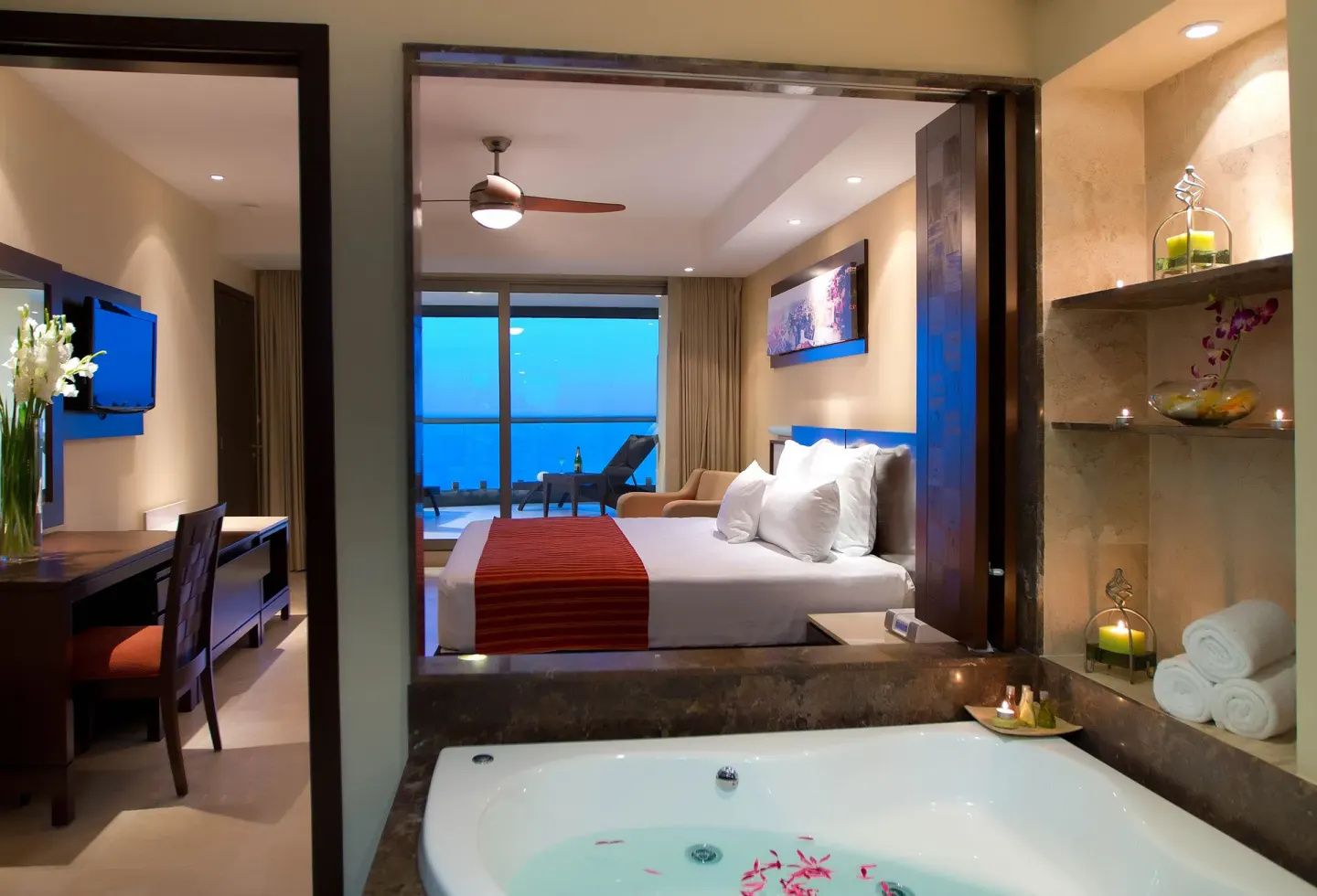Oceanfront Suite hot tub and king bed at Sunset Plaza Beach Resort & Spa Pto Vallarta.