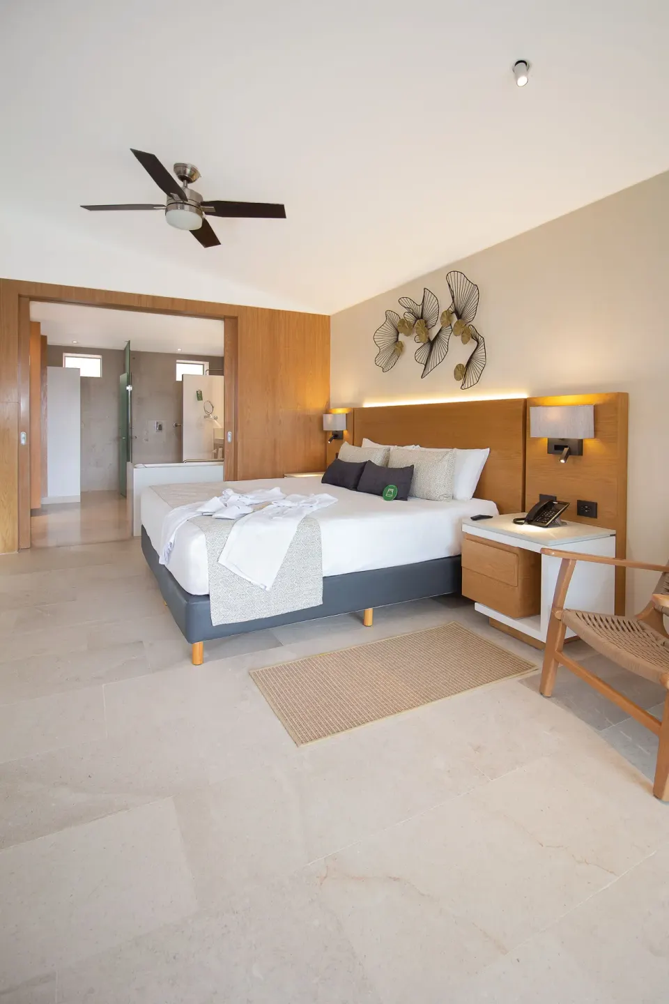Suite Premium Ocean Front king bed and open bath at Sunset Plaza Beach Resort & Spa Pto Vallarta.