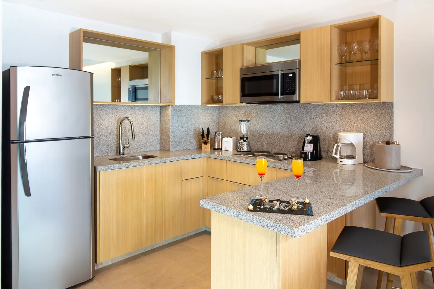 Suite Premium Ocean Front kitchenette with breakfast bar at Sunset Plaza Beach Resort & Spa Pto Vallarta.