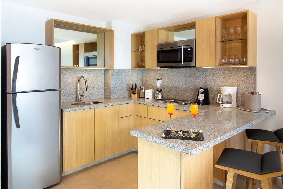 Suite Premium Ocean Front kitchenette with breakfast bar at Sunset Plaza Beach Resort & Spa Pto Vallarta.
