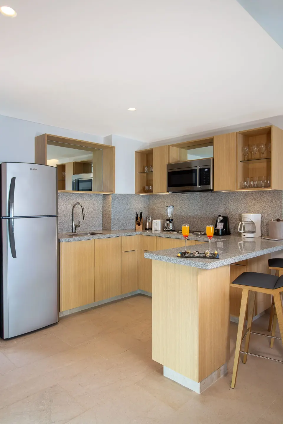Suite Premium Ocean Front kitchenette with island counter at Sunset Plaza Beach Resort & Spa Pto Vallarta.