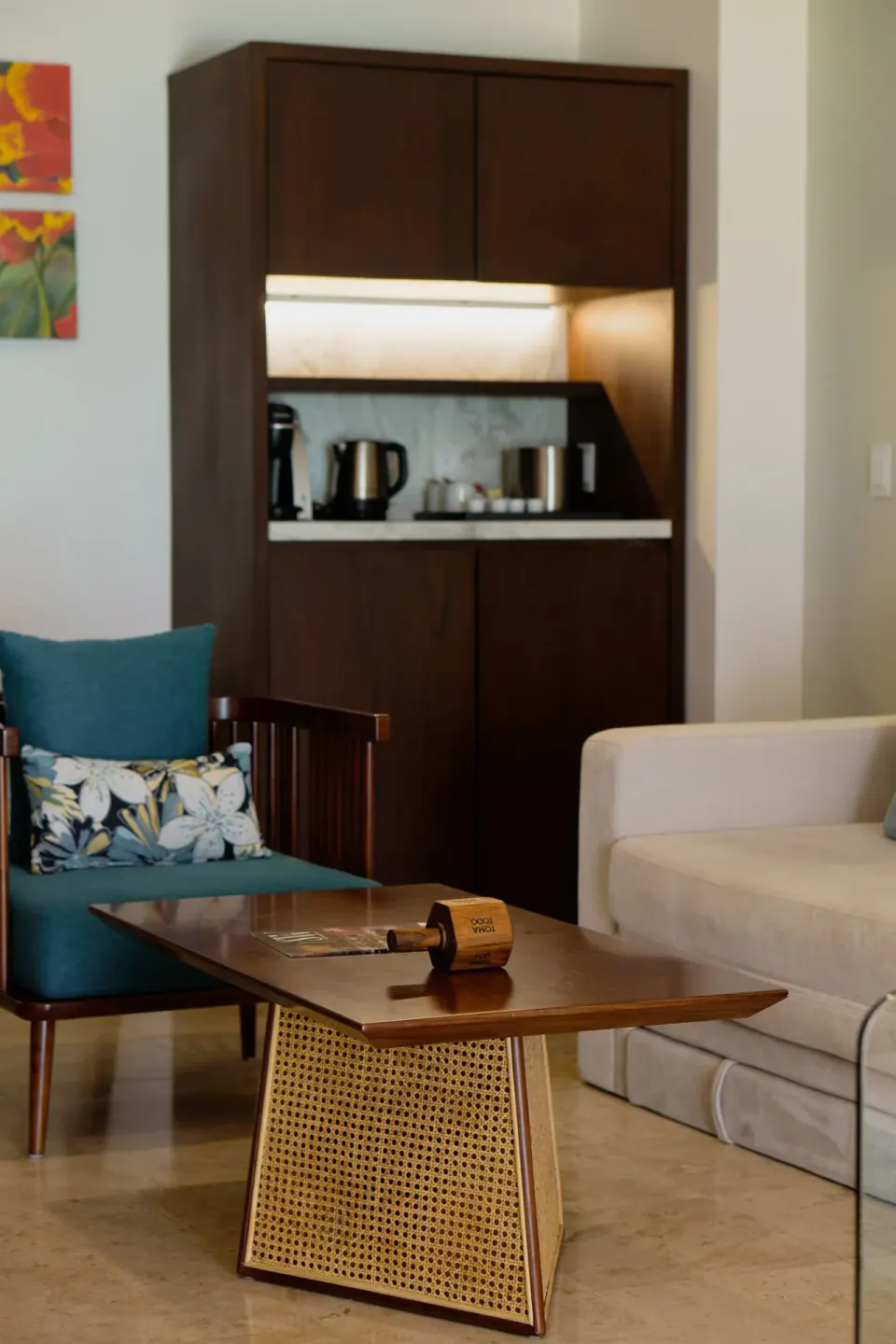Guest room sitting area with coffee station at Sunset Royal Beach Resort.