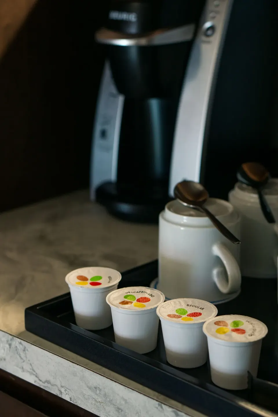 In-room coffee capsules and coffee maker at Sunset Royal Beach Resort.