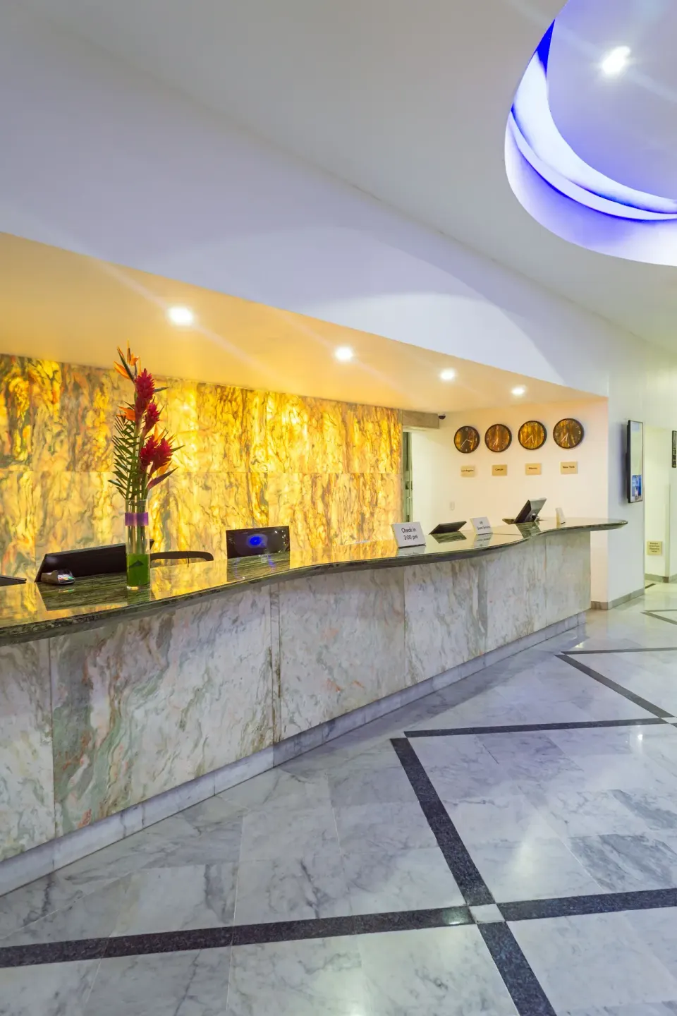 Marble front desk in the lobby at Sunset Royal Beach Resort.