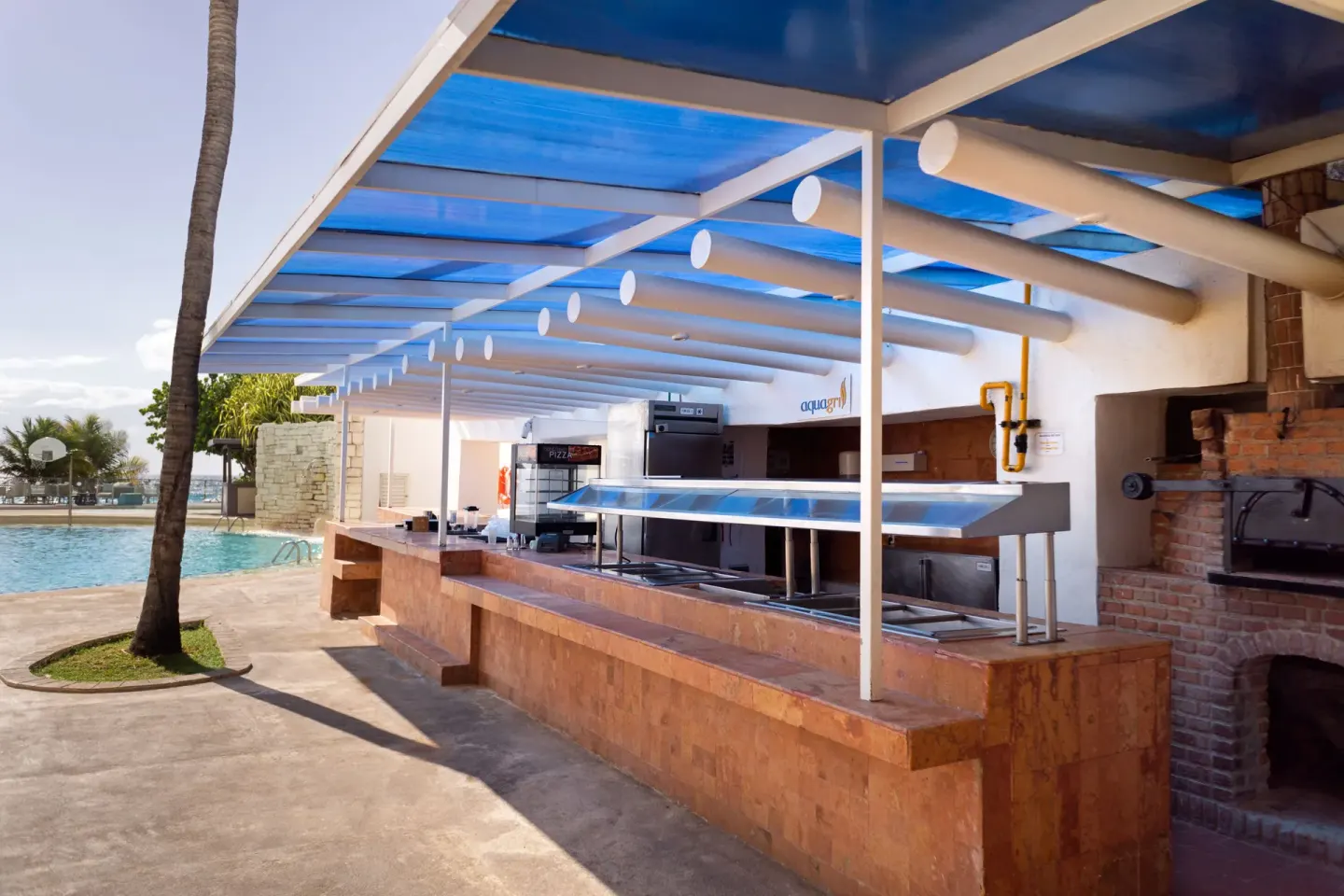 Poolside buffet and brick oven beside the water at Sunset Royal Beach Resort.