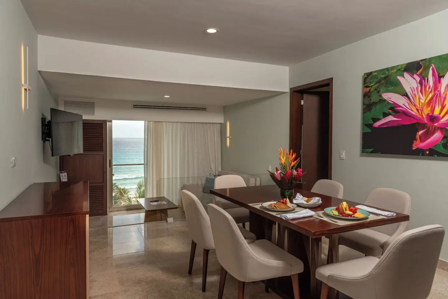 Family Room ocean view dining area and balcony at Sunset Royal Beach Resort.