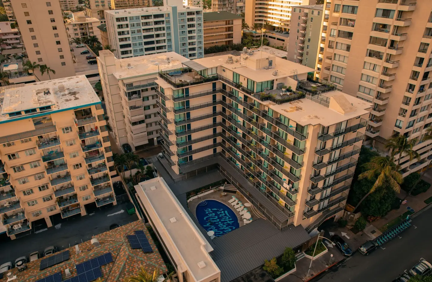 Aerial view of the hotel buildings and courtyard pool at Surfjack Hotel & Swim Club.