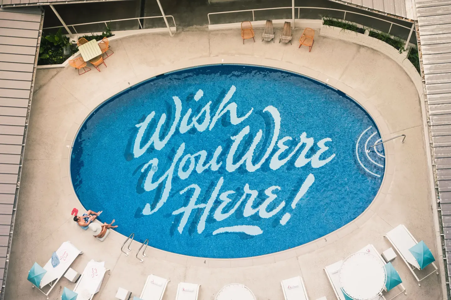 Aerial view of the lettered swimming pool at Surfjack Hotel & Swim Club.