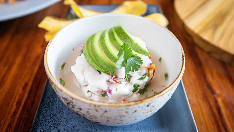 Ceviche topped with sliced avocado in a ceramic bowl at Tabacón Thermal Resort & Spa