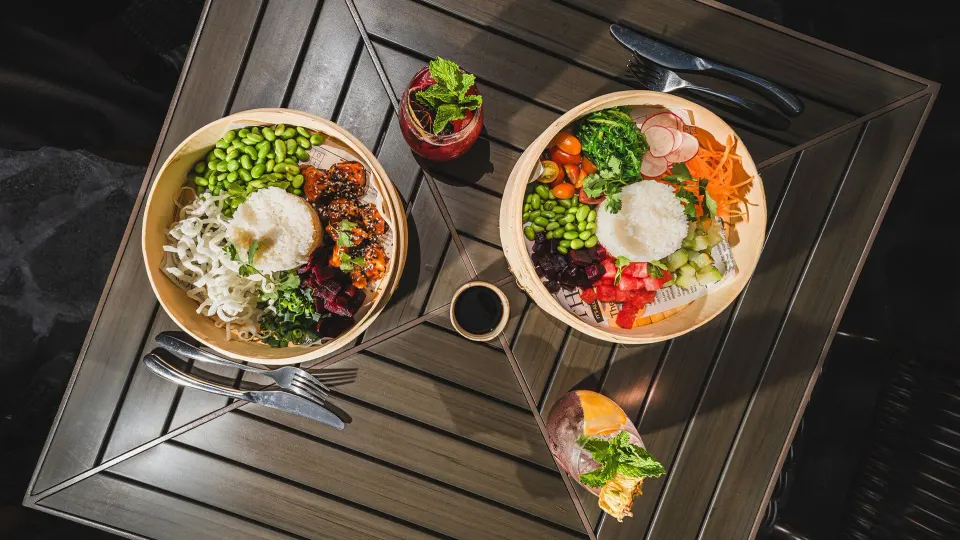 Two rice bowls with vegetables and sauces from Tabacón Thermal Resort & Spa