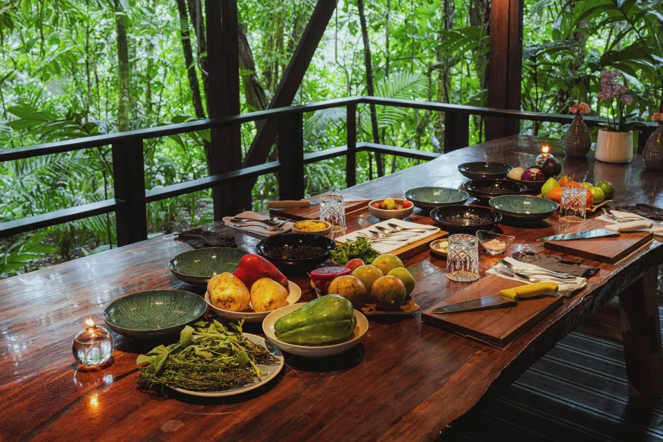 Long wooden table with fresh ingredients on a jungle terrace at Tabacón Thermal Resort & Spa