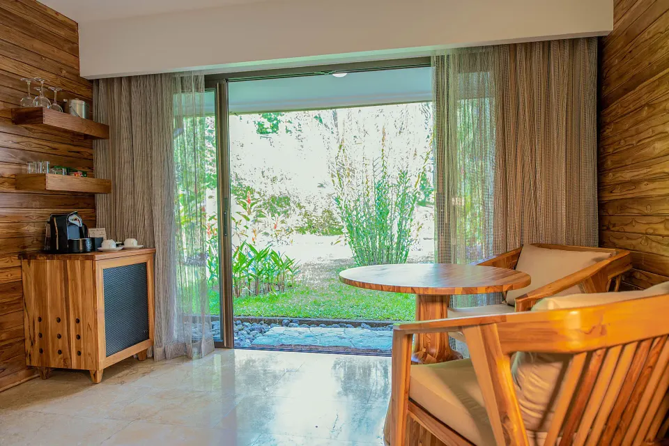 Orchid Room patio with coffee station and garden view at Tabacón Thermal Resort & Spa