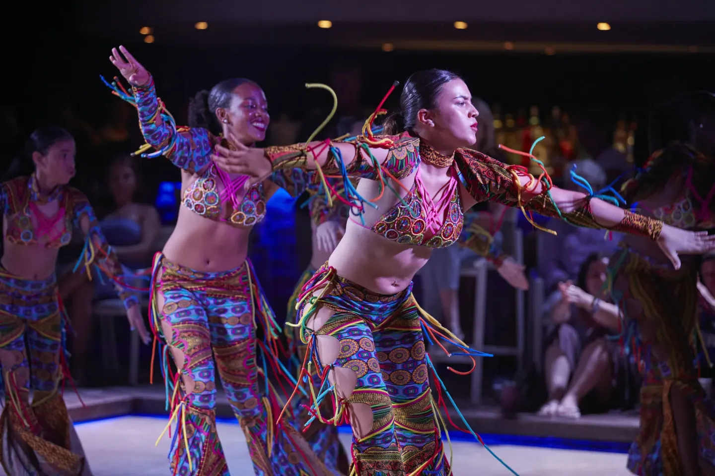 Costumed dancers performing during evening entertainment at Tamarijn Aruba.