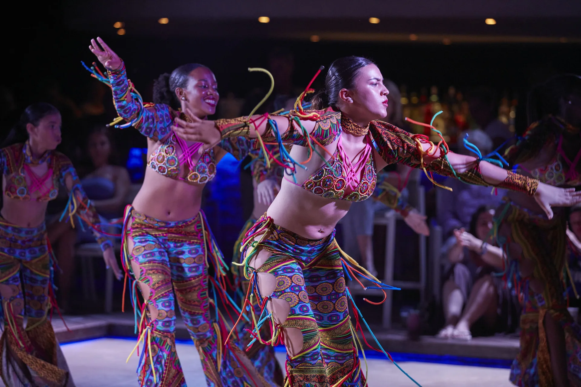 Costumed dancers performing during evening entertainment at Tamarijn Aruba.