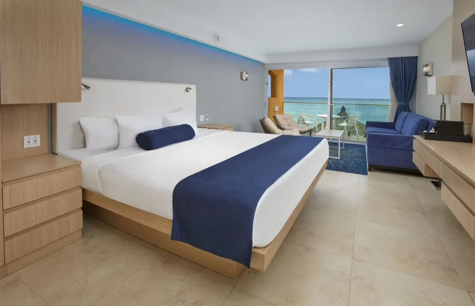 Deluxe Oceanfront room with king bed and sea view at Tamarijn Aruba.