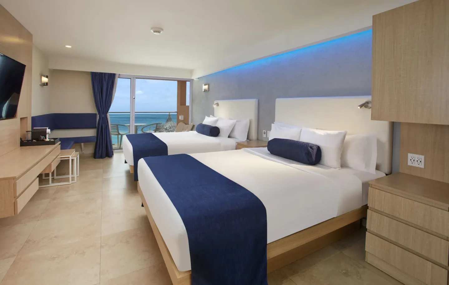 Deluxe Oceanfront room with two beds and balcony sea view at Tamarijn Aruba.