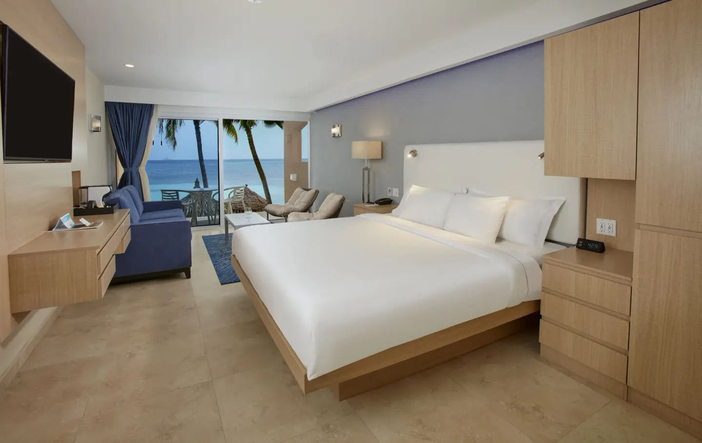 Premium Oceanfront Room with king bed and ocean view at Tamarijn Aruba.