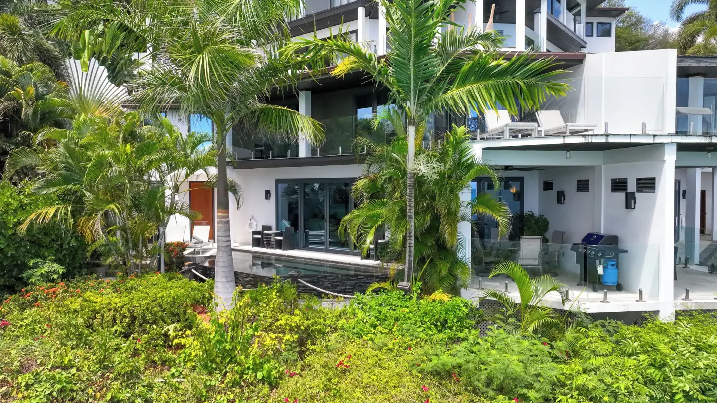 Tropical villa exterior with terraces and palms at Tamarind Hills Resort & Villas.