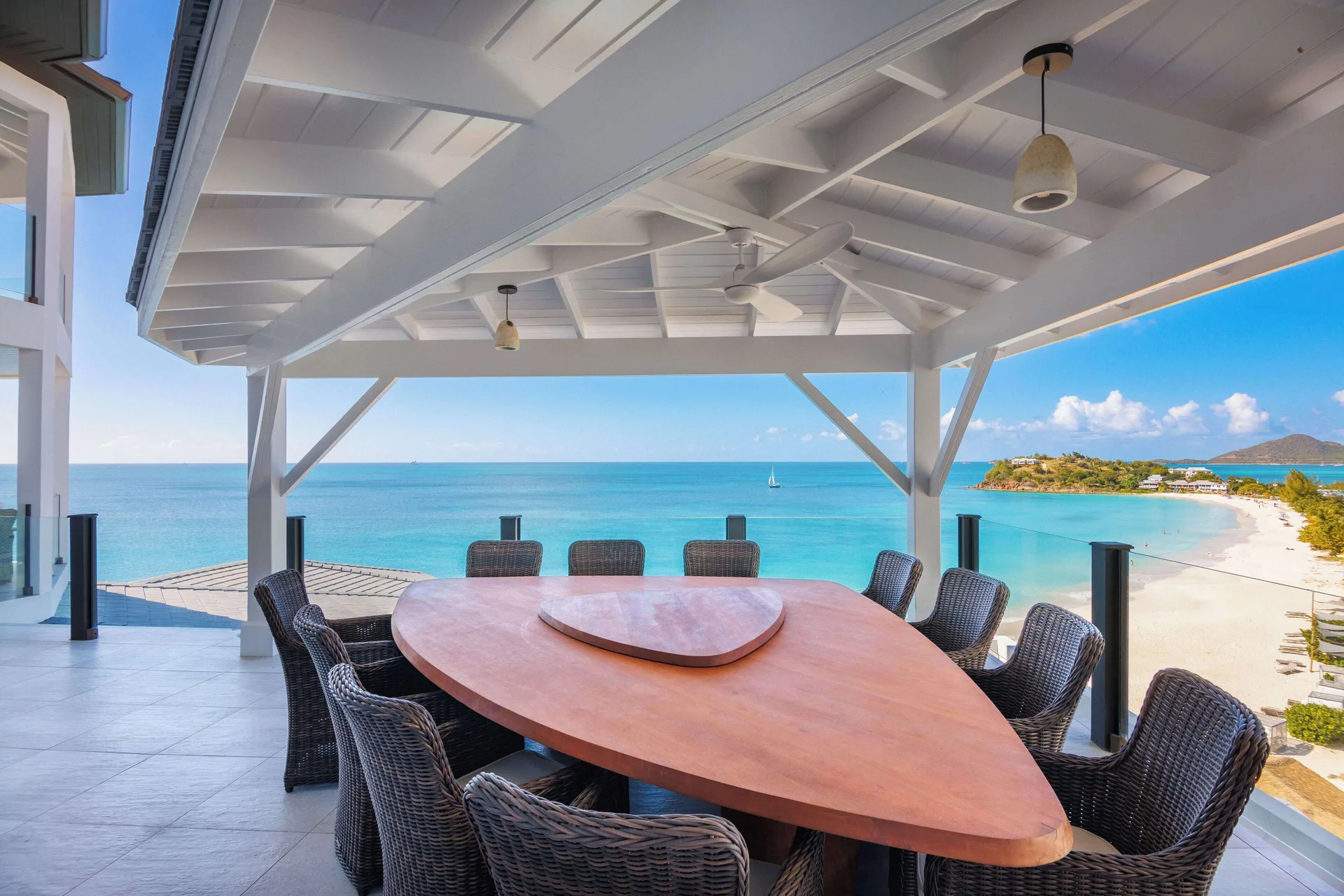 Covered outdoor dining terrace overlooking the beach at Tamarind Hills Resort & Villas.