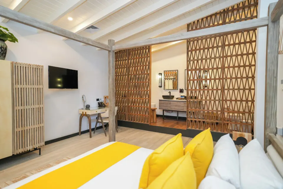 Ocean 19 guest room with king bed and open bathroom at Tamarind Hills Resort & Villas.