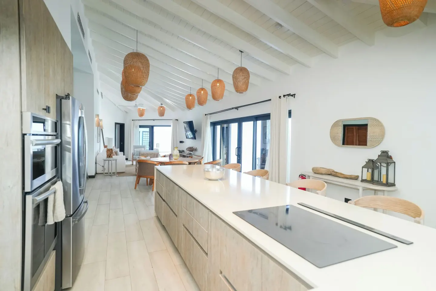 Ocean 19 kitchen with long island and sliding doors at Tamarind Hills Resort & Villas.