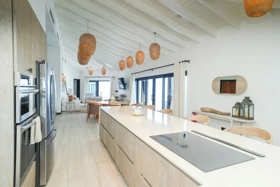 Ocean 19 kitchen with long island and sliding doors at Tamarind Hills Resort & Villas.