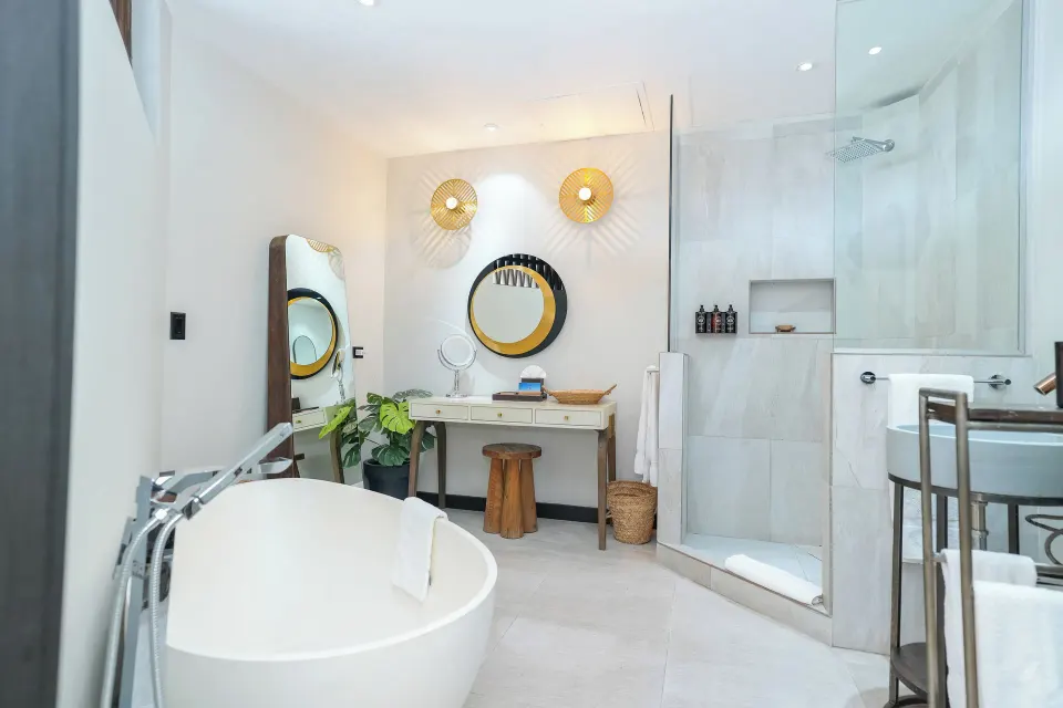 Seastar bathroom with soaking tub and glass shower at Tamarind Hills Resort & Villas.