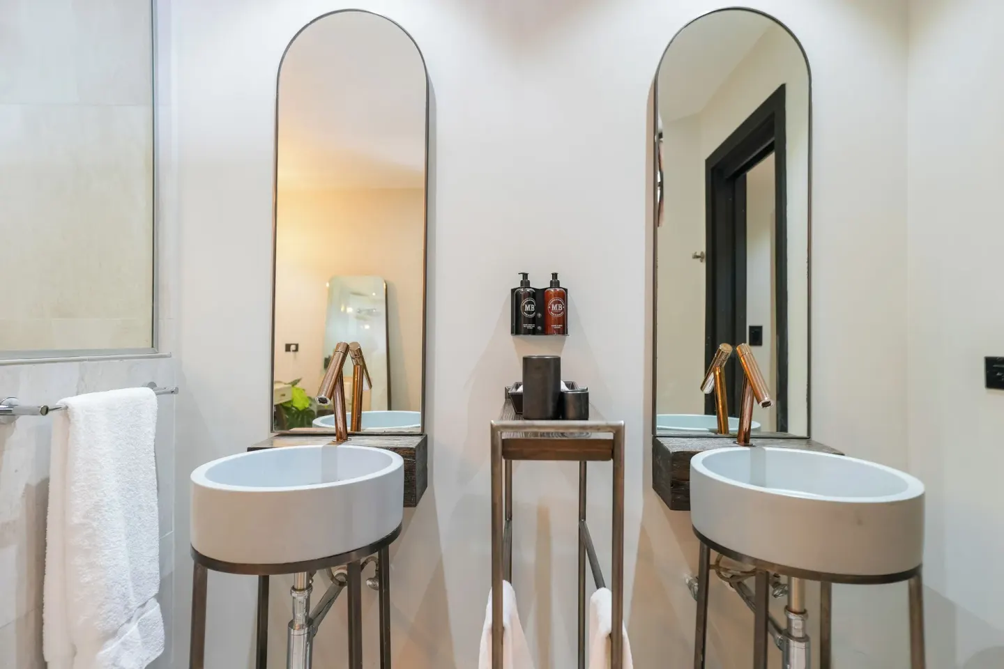 Seastar bathroom double basins and tall mirrors at Tamarind Hills Resort & Villas.