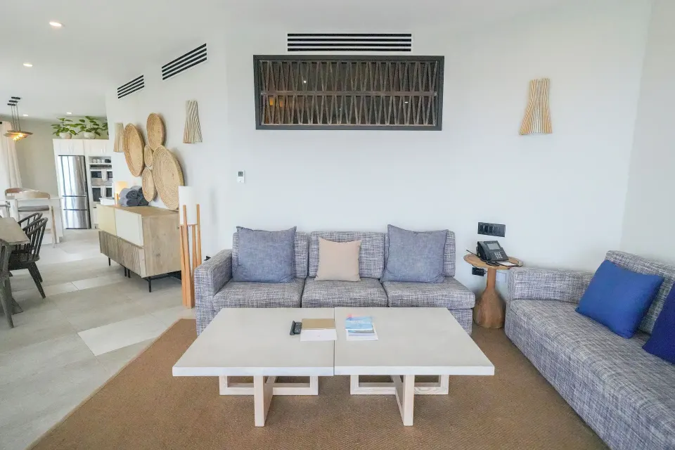 Seastar living room with sofas and coffee tables at Tamarind Hills Resort & Villas.