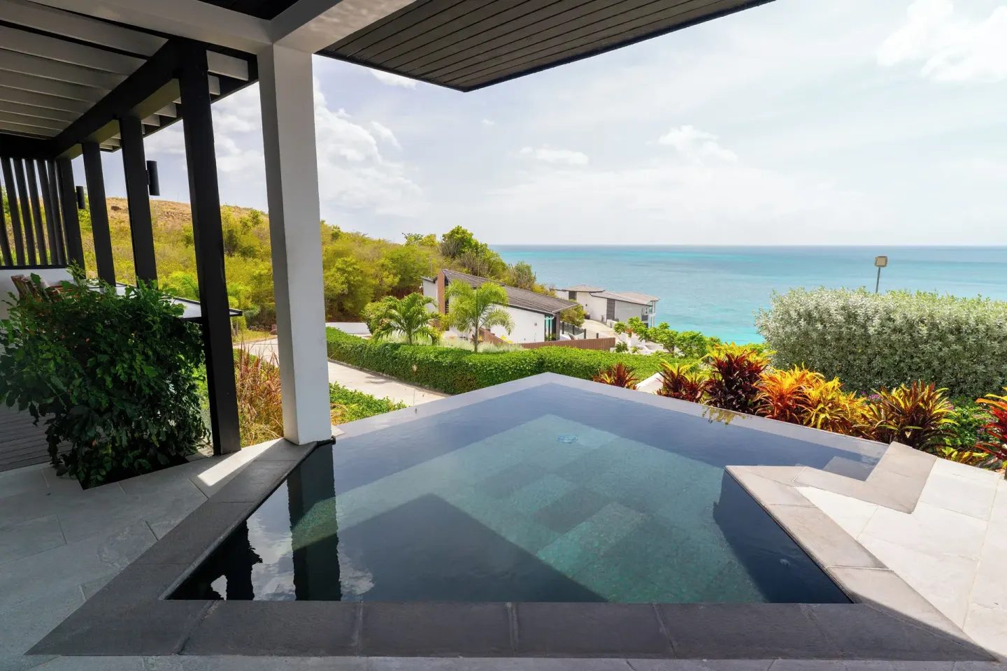 Seastar terrace plunge pool with ocean view at Tamarind Hills Resort & Villas.
