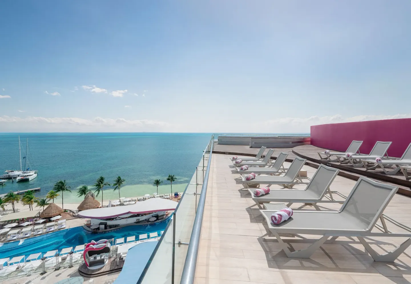 Rooftop sun loungers overlooking the sea at Temptation Cancún.