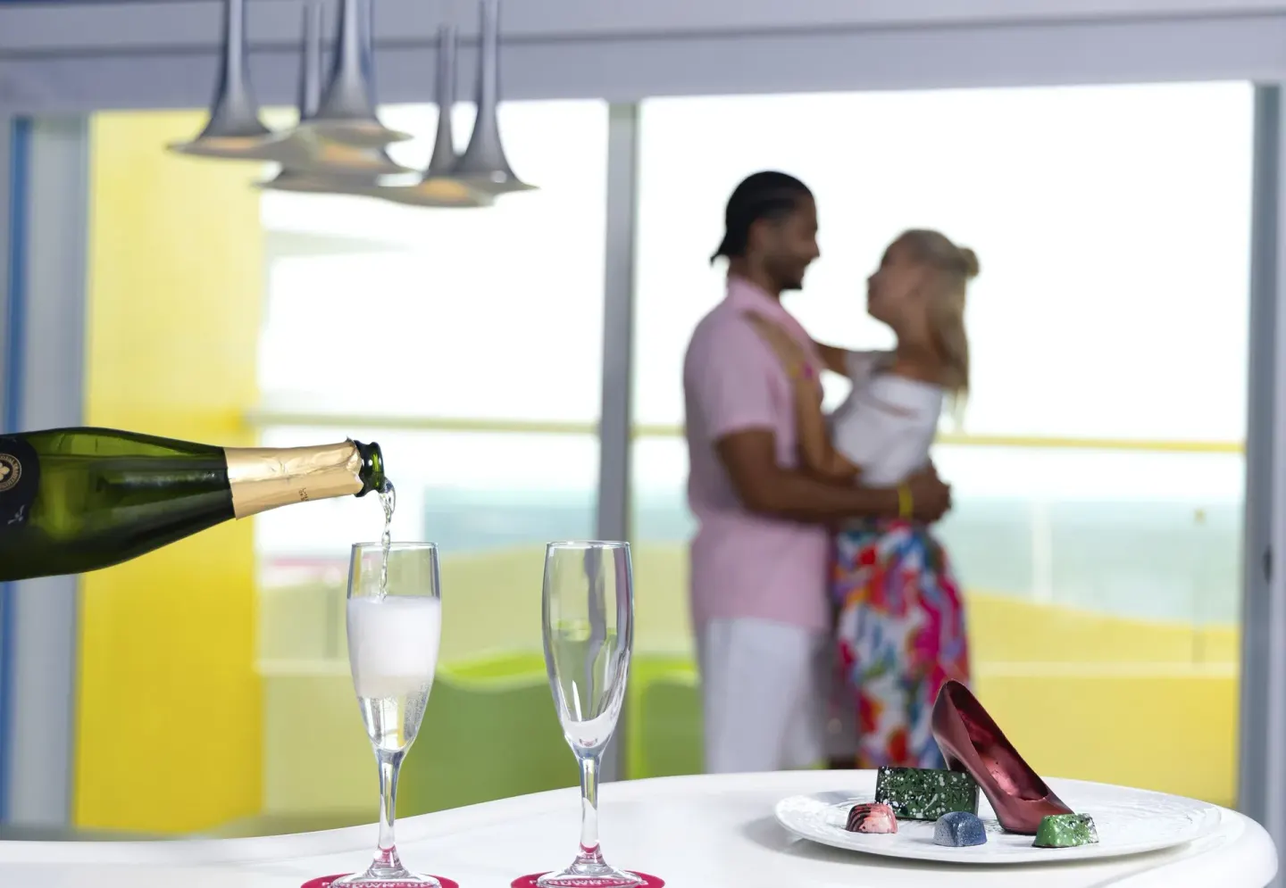 Sparkling wine and dessert set by a balcony at Temptation Cancún.