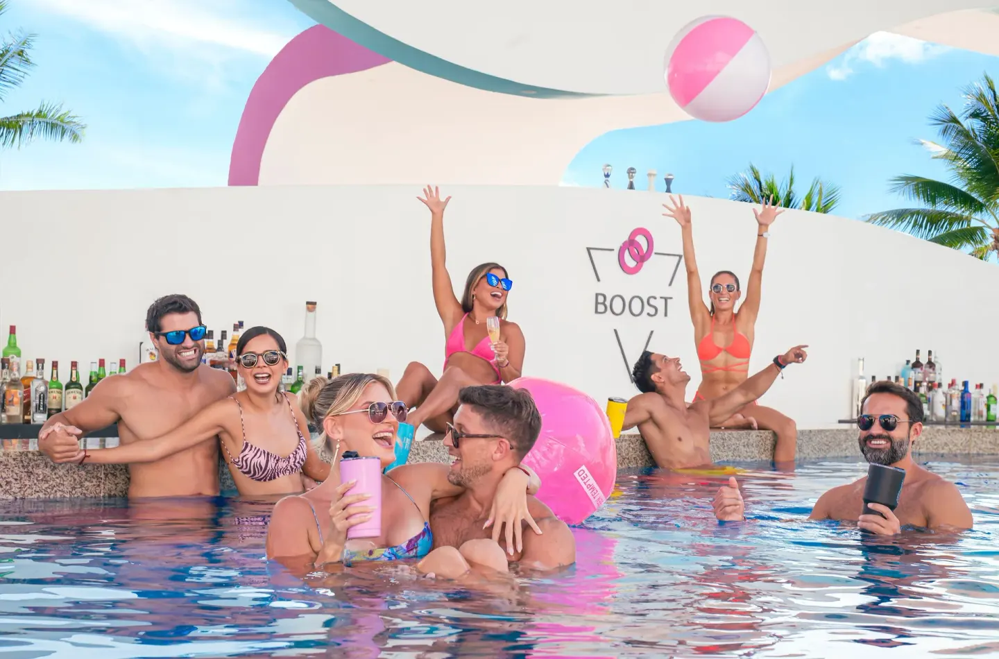Guests socialize in a swim-up pool bar at Temptation Cancún.