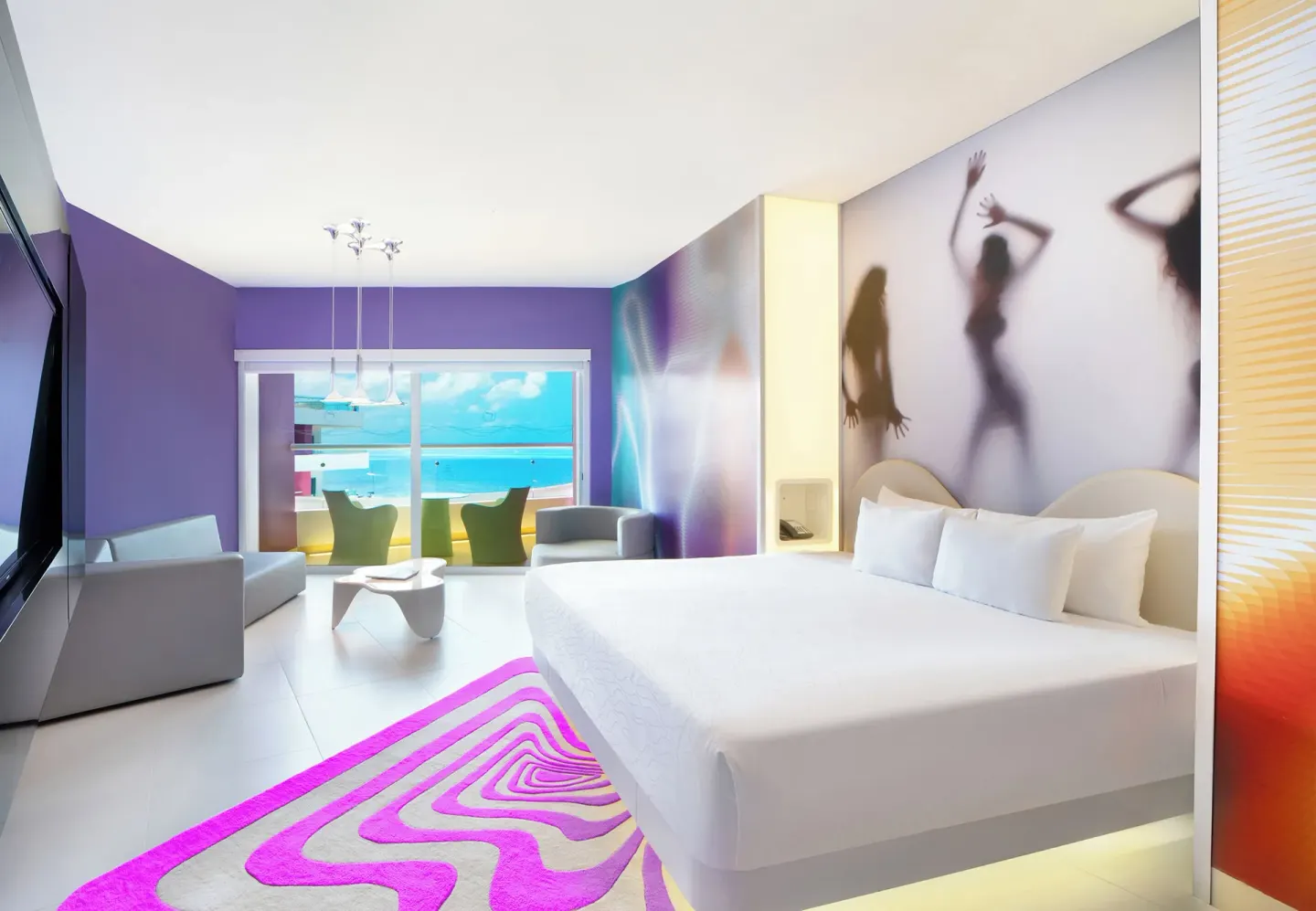 Bash Tower Ocean View king bed room at Temptation Cancún with balcony seating and sea view.