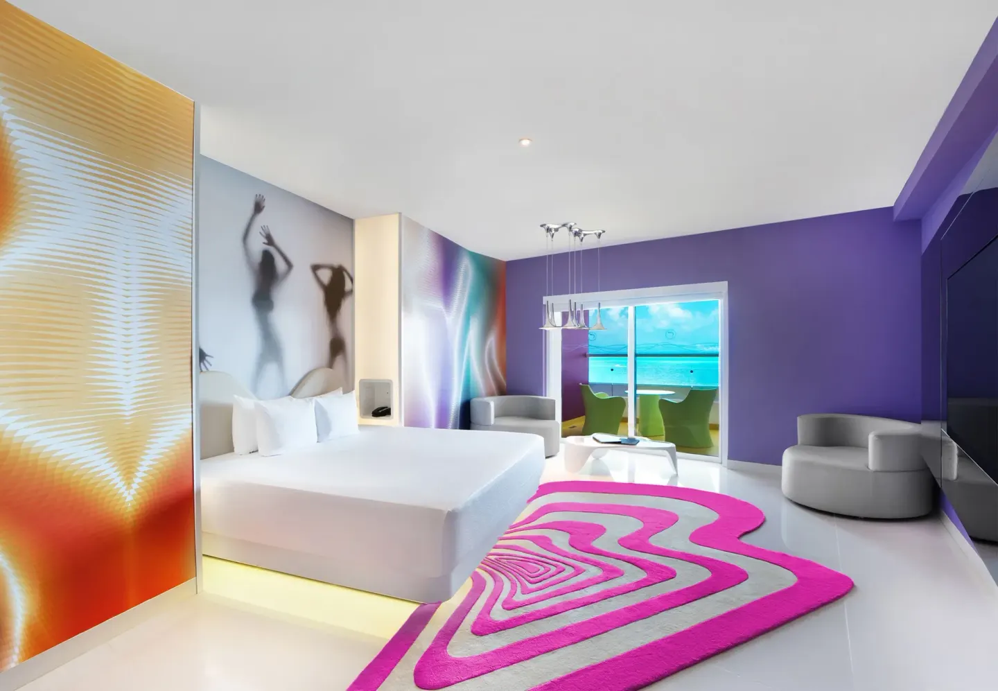 Lush Tower Ocean Front king bed with balcony ocean view at Temptation Cancún.