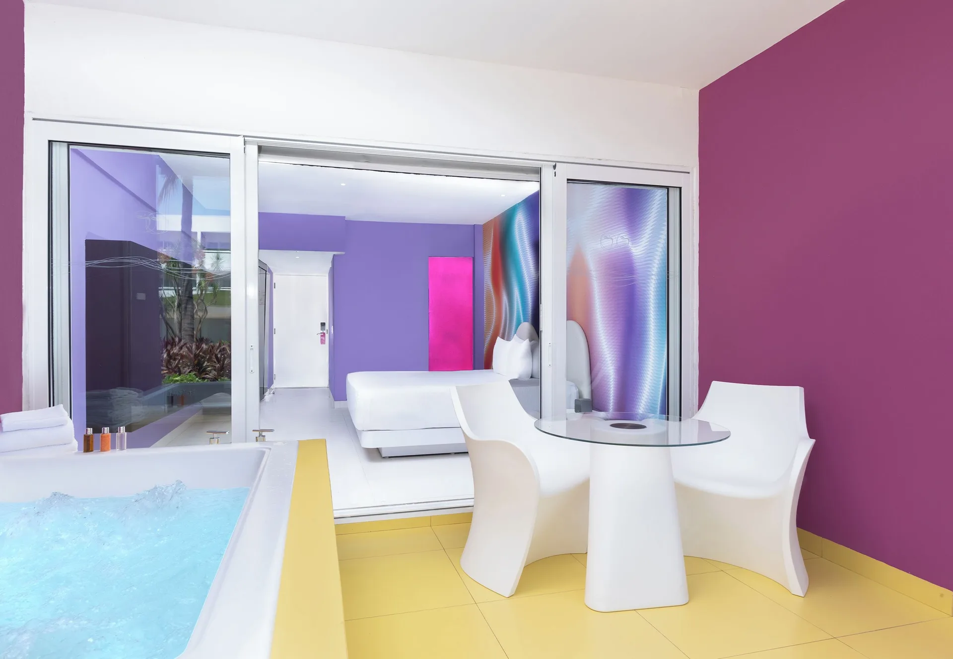 Plush Jacuzzi Ocean View/Garden View patio with whirlpool and room view at Temptation at The Tower Cancún.