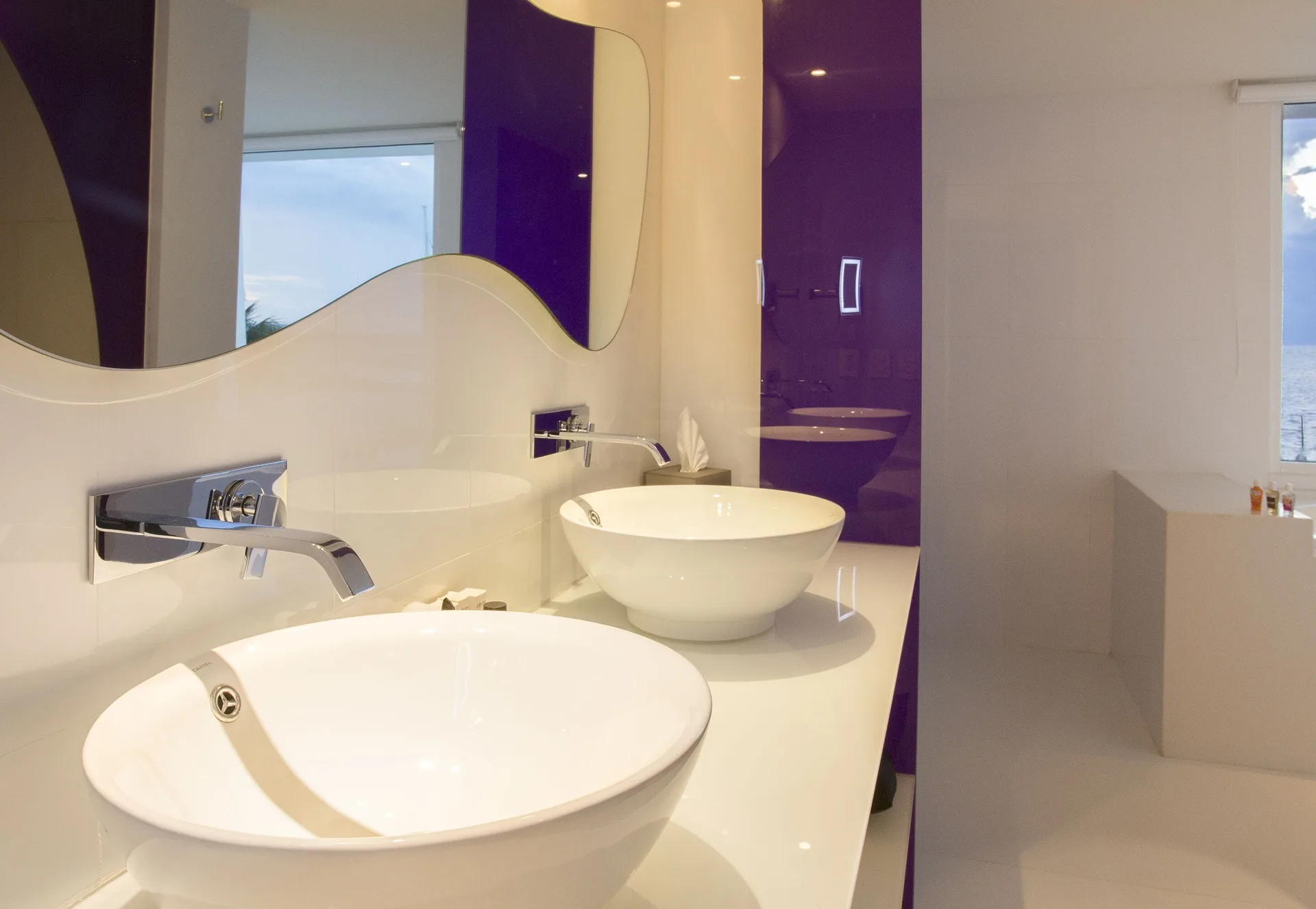 Seduction Beachfront Suite bathroom with twin vessel sinks at Temptation at The Tower Cancún.