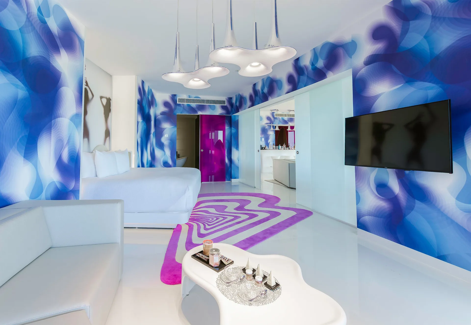 Oceanfront Master Suite living area and bed at Temptation at The Tower Cancún.